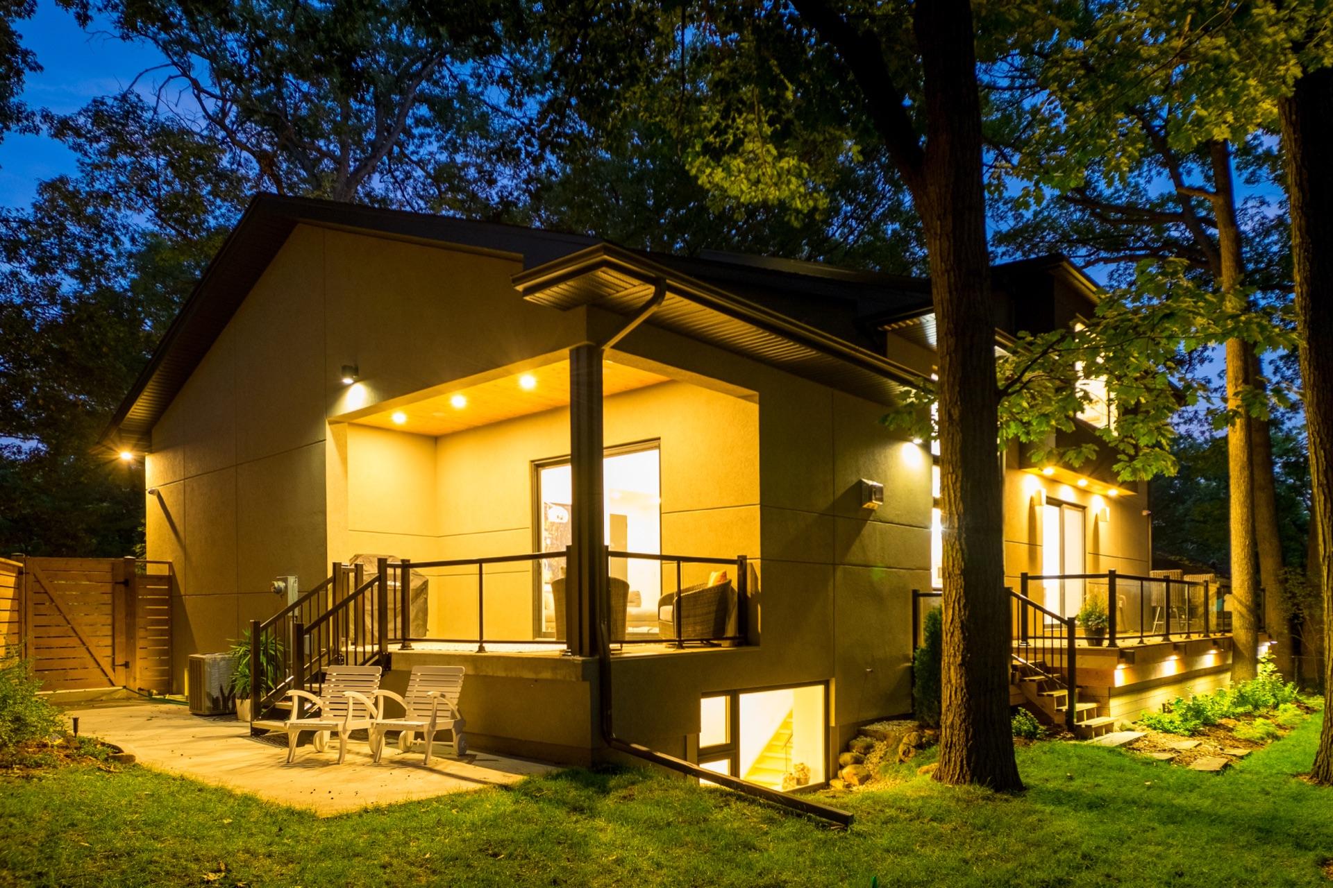 Nighttime view of glass balcony railing with lighting