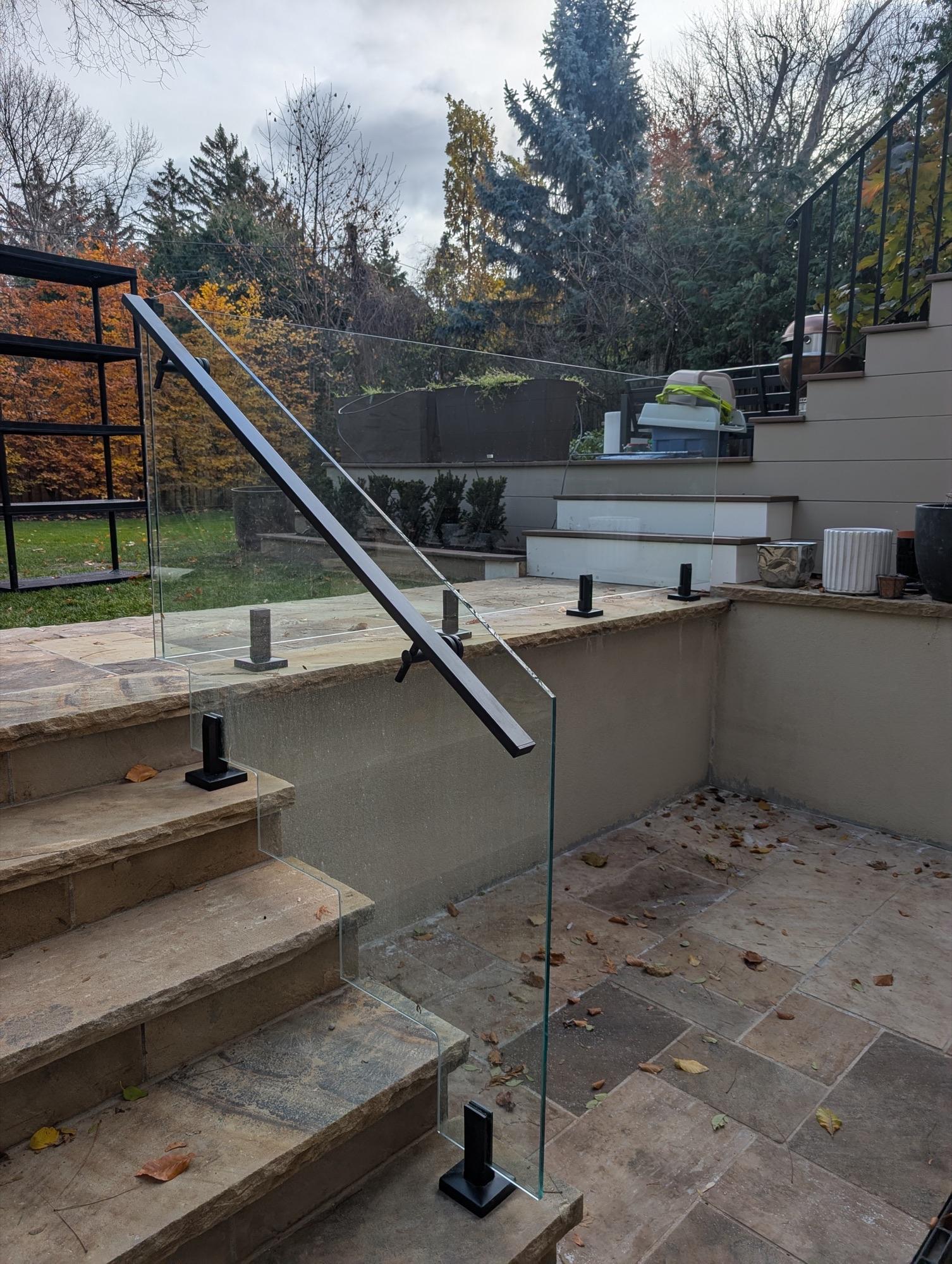 Minimalist exterior glass guardrail system GTA