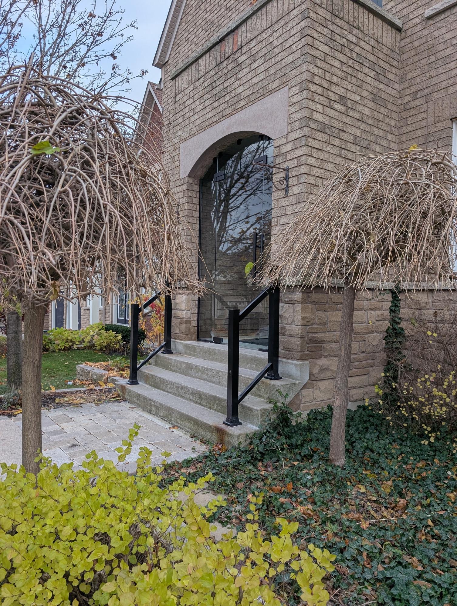 Modern glass entry enclosure for North York home exterior