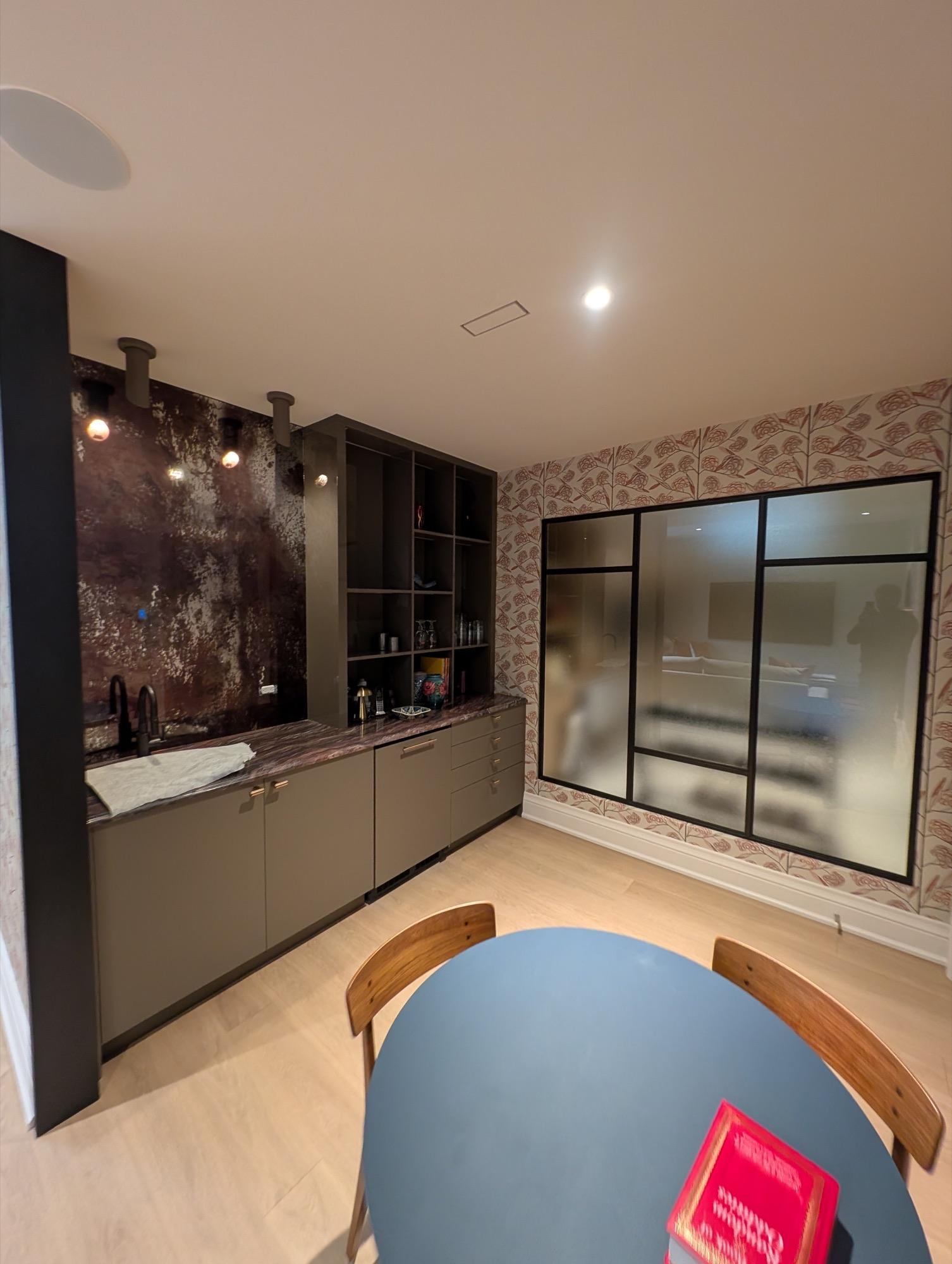 Close-up of black powder-coated brass frame and textured glass